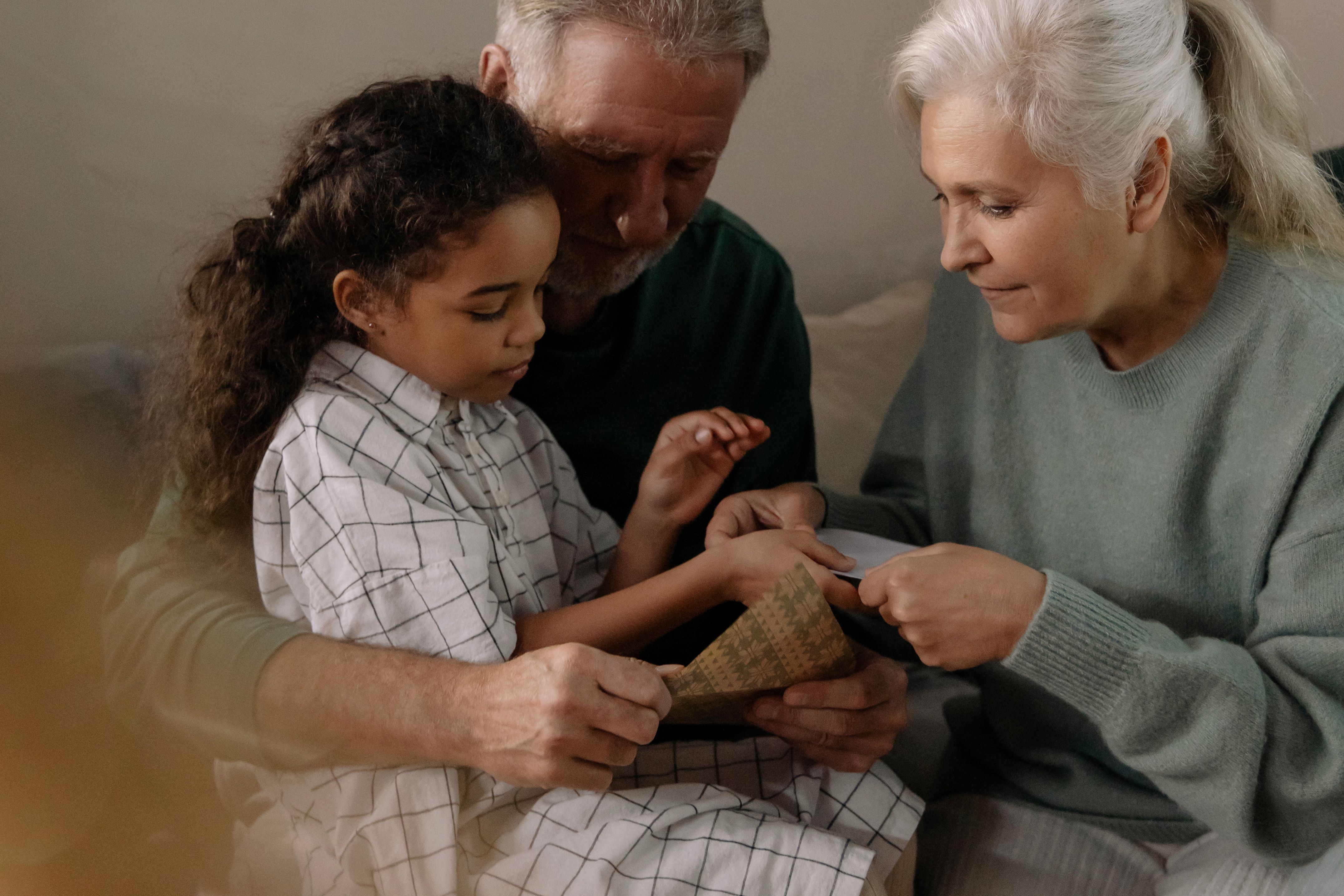 Grandparents sharing a moment with their granddaughter